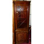 A contemporary mahogany freestanding corner cupboard, having astragal glazed single upper door, h.