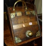 A late Victorian walnut and brass mounted coal purdonium with shovel