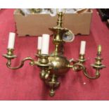 A Dutch style brass five light electrolier, dia. 52cm, together with a pair two branch wall