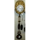 A Morbier of France circa 1900 comtoise clock, having signed convex white enamel dial within