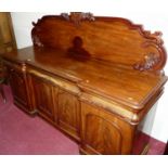 An early 19th century style oak and mahogany crossbanded breakfront cabinet, of joined construction,