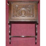 An early 20th century relief carved oak single door hanging wall cupboard, with lower shelf, w.39.