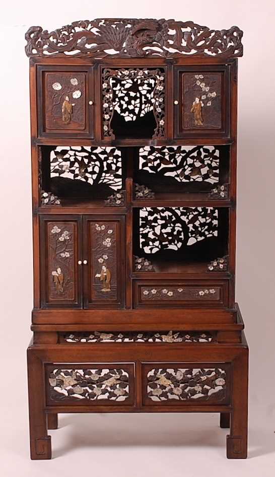 A Japanese Meiji period hardwood Shodana cabinet on stand, arranged as various cupboards and open