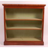 A mahogany freestanding open bookshelf, in the Victorian style, having a crossbanded and inlaid