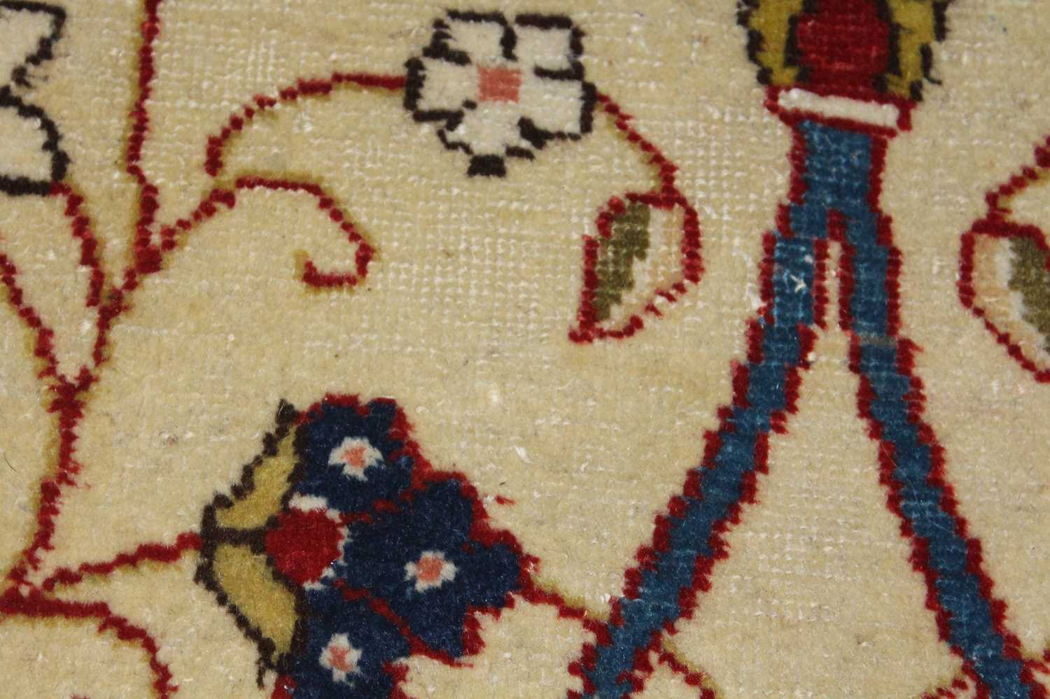 A Persian woollen cream ground carpet, decorated with scroll flowers and foliage within trailing - Image 24 of 24