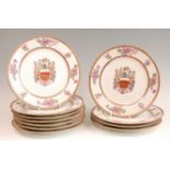 A set of eleven continental porcelain armorial plates, probably Paris, decorated in bright enamels