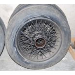 A pair of Rolls Royce spoked wheels, circa 1930s; together with one other tyre (3)