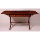 A Regency mahogany and ebony strung sofa table, having two real and two dummy frieze drawers, each
