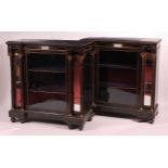 A pair of late Victorian Aesthetic Movement ebonised inverted breakfront side cabinets, having brass