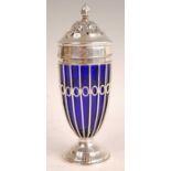 A late Victorian silver pedestal lighthouse sugar caster, having flaming torch finial and blue glass