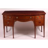 A George III mahogany bowfront sideboard, having a central drawer flanked by cupboard door, with