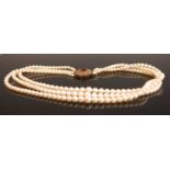 A three-row cultured pearl necklet, comprising 77, 83, and 87 graduated cultured pearls, measuring