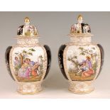 A pair of circa 1900 Dresden porcelain vases and covers, each panel decorated with alternating