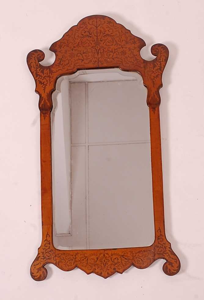 A late 19th century rosewood and satinwood wall mirror, in the Chippendale style, having a seaweed