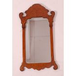 A late 19th century rosewood and satinwood wall mirror, in the Chippendale style, having a seaweed