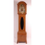 J.H. Dixon Hurst - an Edwardian mahogany and inlaid longcase clock, having 12" arched brass dial,