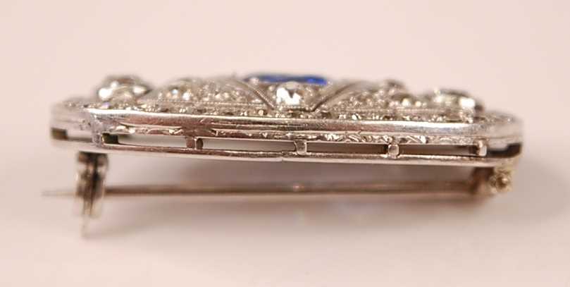 A white metal Art Deco style sapphire and diamond lozenge shaped panel brooch, featuring a centre - Image 3 of 3