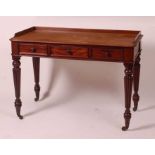 A Victorian mahogany side table by T. Willson of Great Queen Street, London, stamped to the frieze