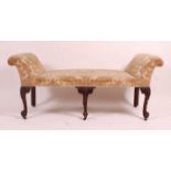 A George III mahogany framed window seat, of serpentine outline, having an upholstered top with