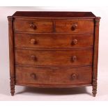 A George IV mahogany bowfront chest, of two short and three long graduated cockbeaded drawers within
