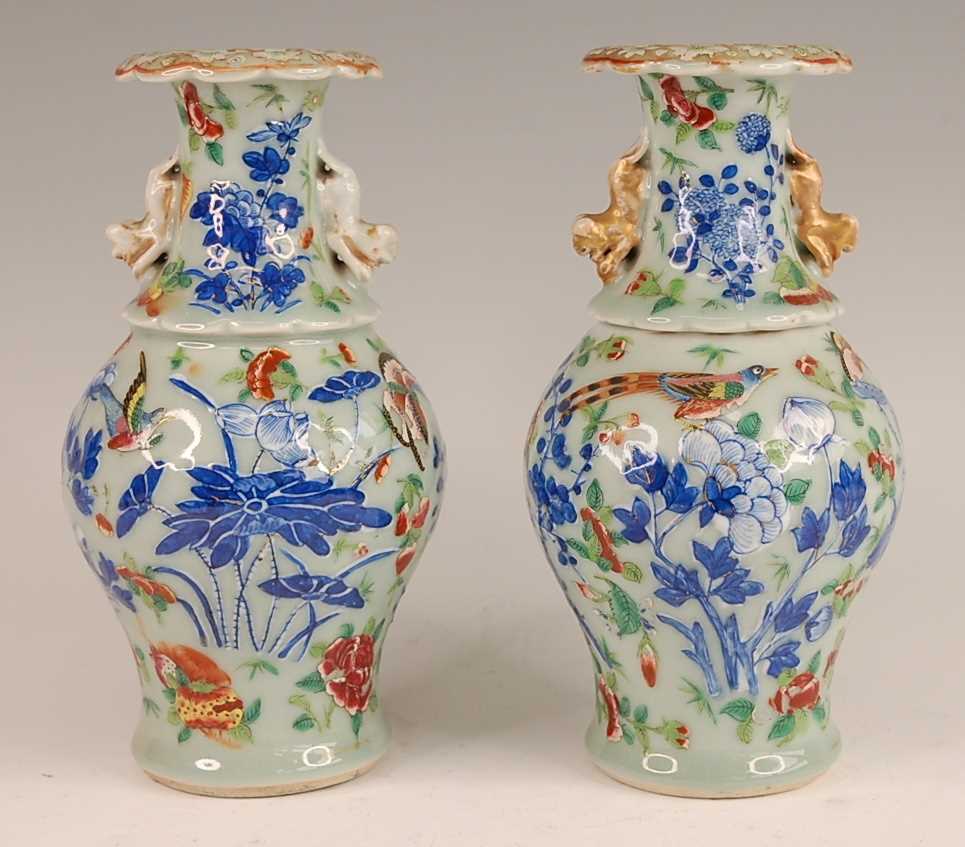 A pair of 19th century Chinese stoneware celadon ground vases, each enamel decorated with exotic