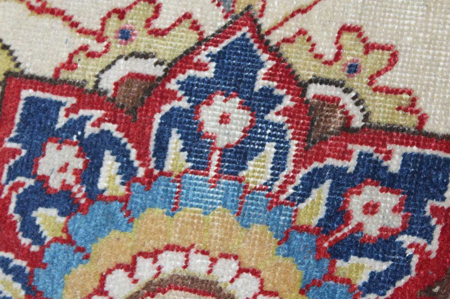 A Persian woollen cream ground carpet, decorated with scroll flowers and foliage within trailing - Image 22 of 24