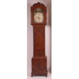 An early 19th century mahogany longcase clock, having an unsigned painted 12" arch dial, with