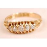 An 18ct yellow gold diamond five-stone half hoop eternity ring, comprising five graduated Old