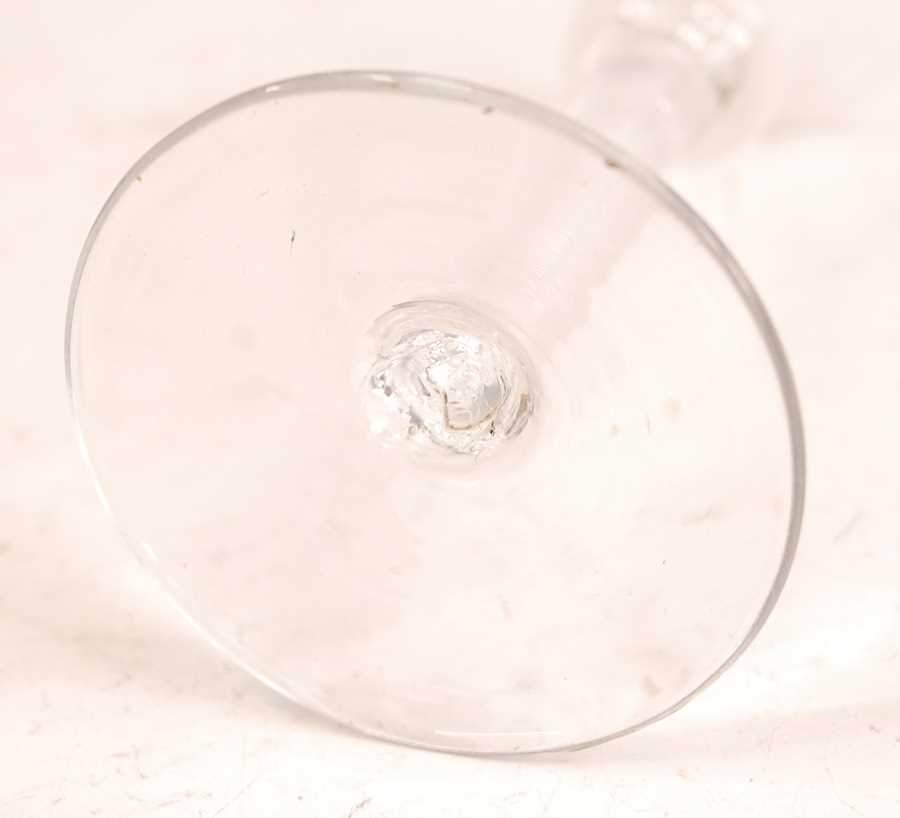 A mid-18th century wine glass, the waisted bell bowl over clear glass spiral twist column to a - Image 2 of 2