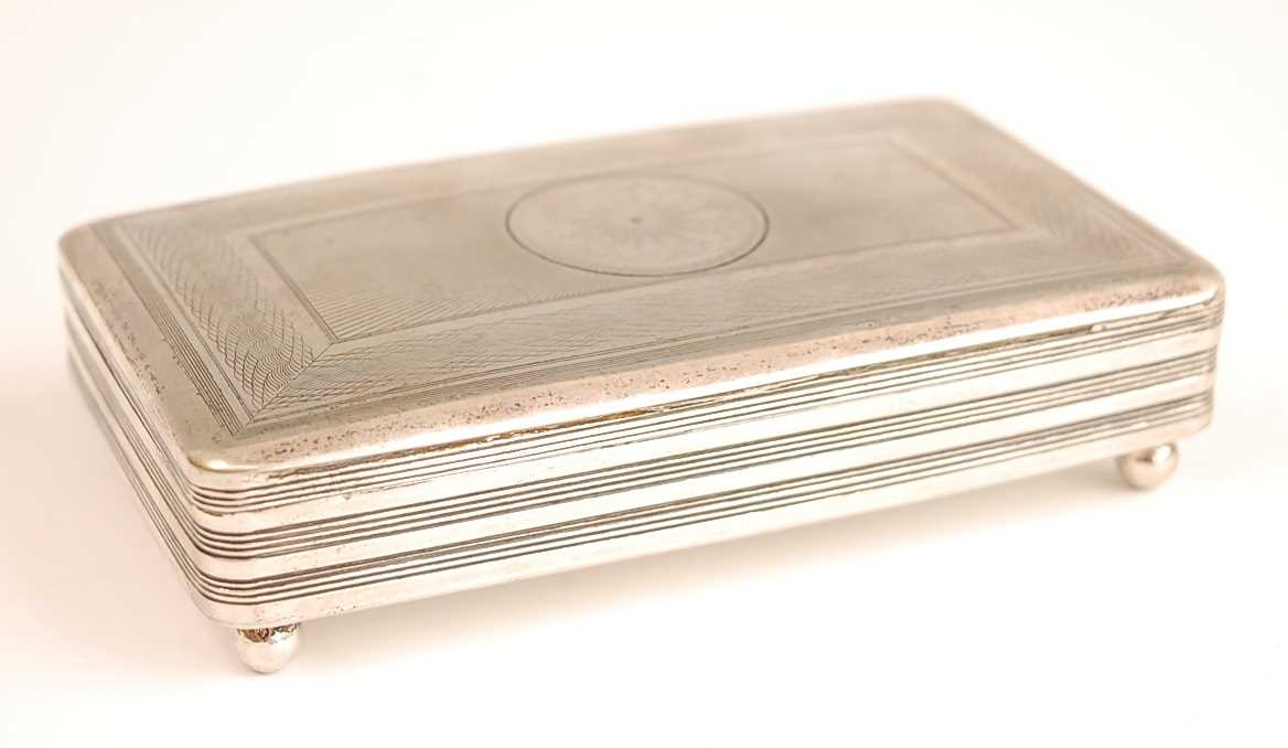 A 19th century Dutch silver tobacco box, having engine turned hinged cover and reeded banded