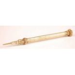 A Victorian gilt metal propelling pencil, having a fluted body and agate set seal top, 9cm (closed)