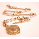 A 9ct gold fetter and three link watch chain, with T bar and 9ct medallion pendant, 48.7g, 34cm (