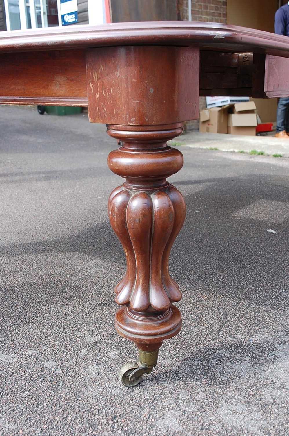 A Victorian mahogany extending dining table, of good size, the top having double wind-out action, - Image 5 of 7