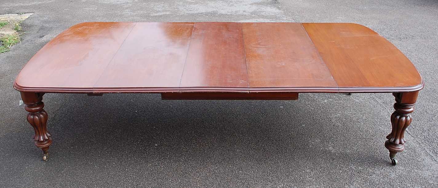 A Victorian mahogany extending dining table, of good size, the top having double wind-out action,