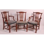 A set of twelve mahogany dining chairs, in the Hepplewhite style, each having swept top rails,