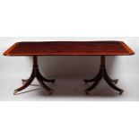 A fine quality mahogany, rosewood and satinwood crossbanded twin pedestal dining table, in the