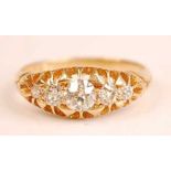A late Victorian 18ct yellow gold five-stone diamond half hoop eternity ring, comprising five