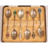 A cased set of six Art Deco silver and enamel coffee spoons, each with different coloured enamel set