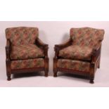 A pair of carved and stained beechwood Bergere library armchairs, each having re-upholstered deep