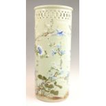 A Japanese celadon glazed stoneware stick / umbrella stand, of cylindrical form with pierced frieze,