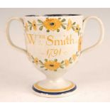 A George III pearlware pedestal loving cup, the bell shaped bowl inscribed William Smith and dated