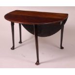 A George III mahogany padfoot dining table, the oval leaves on gatelegs, w.110cm, d.141cm, h.