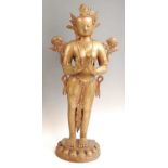 A probably Tibetan bronze figure of the Buddhist Goddess Tara, in standing pose adorned with lotus