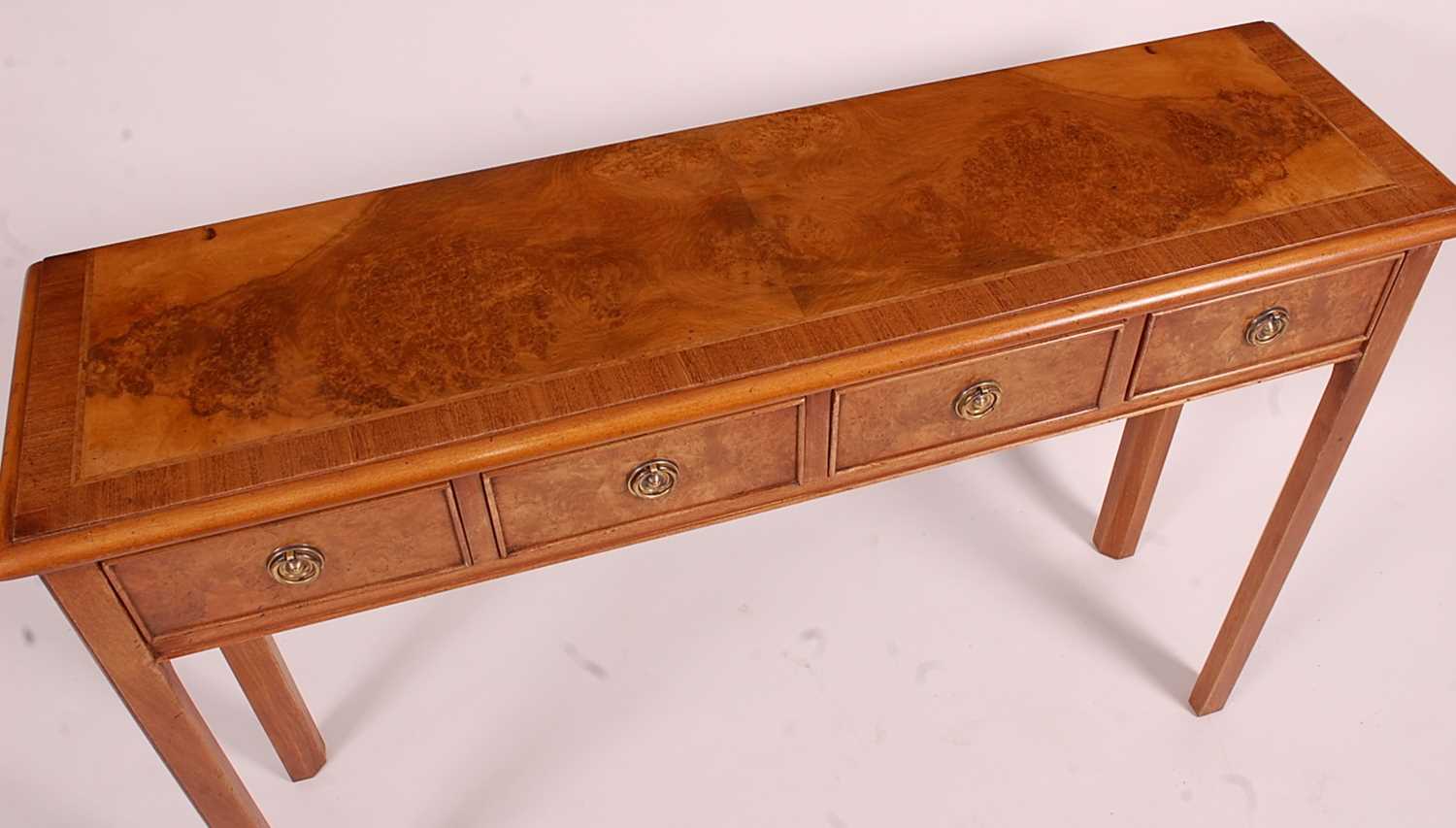 A walnut and burr walnut four drawer hall table, having a cross and feather banded top, raised on - Image 2 of 2