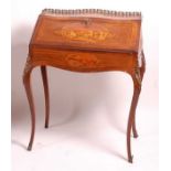 A circa 1900 continental rosewood Bureau de Dame, of slender bombe form, the fall being marquetry
