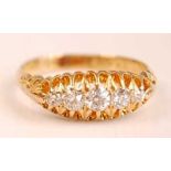An Edwardian 18ct yellow gold diamond five-stone half hoop eternity ring, featuring five graduated