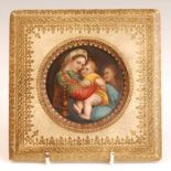 19th century continental school - Madonna and Child, miniature on porcelain, dia.9cm, housed in a