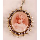 A late Victorian yellow metal oval memorial pendant, depicting a picture of a young girl within an