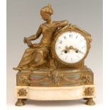 A 19th century gilt brass mantel clock, having an unsigned convex white enamel dial, twin winding