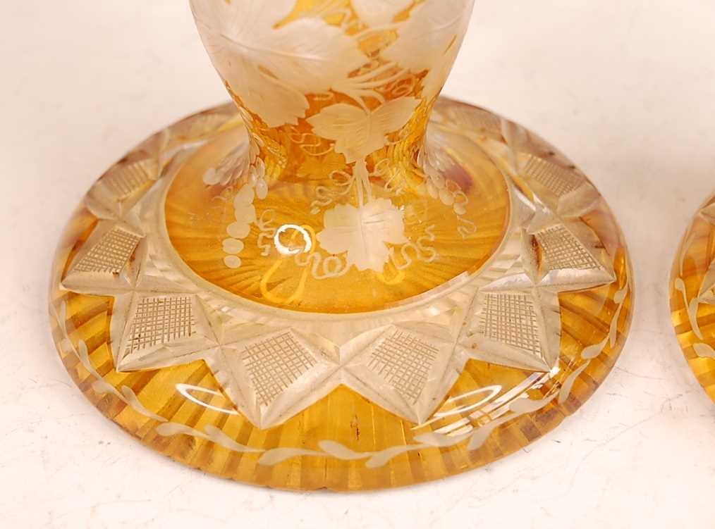 A pair of Bohemian cut and amber flash glass candle-holders, each further acid etched with - Image 3 of 3